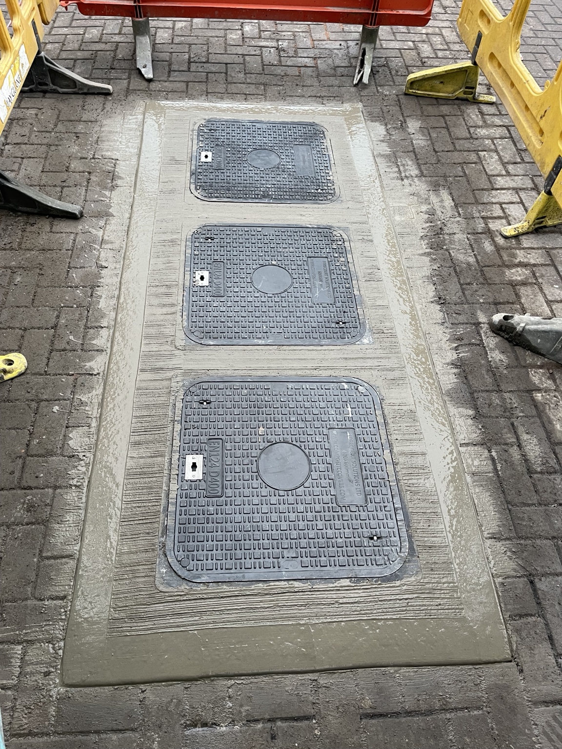 New composite chamber covers in a concrete surround
