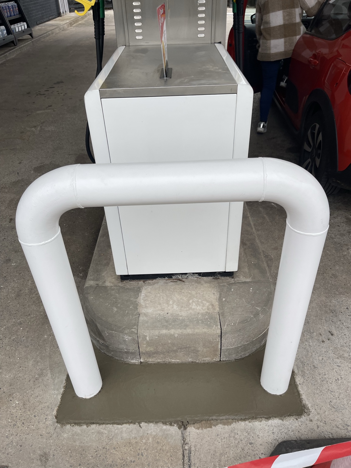New dispenser protection barrier with concrete footing